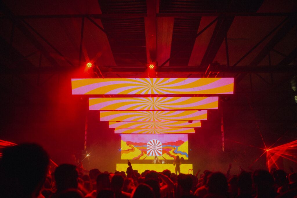 A DJ performing at a popular Las Vegas nightclub with lights and visuals. — Las Vegas nightclubs 2026