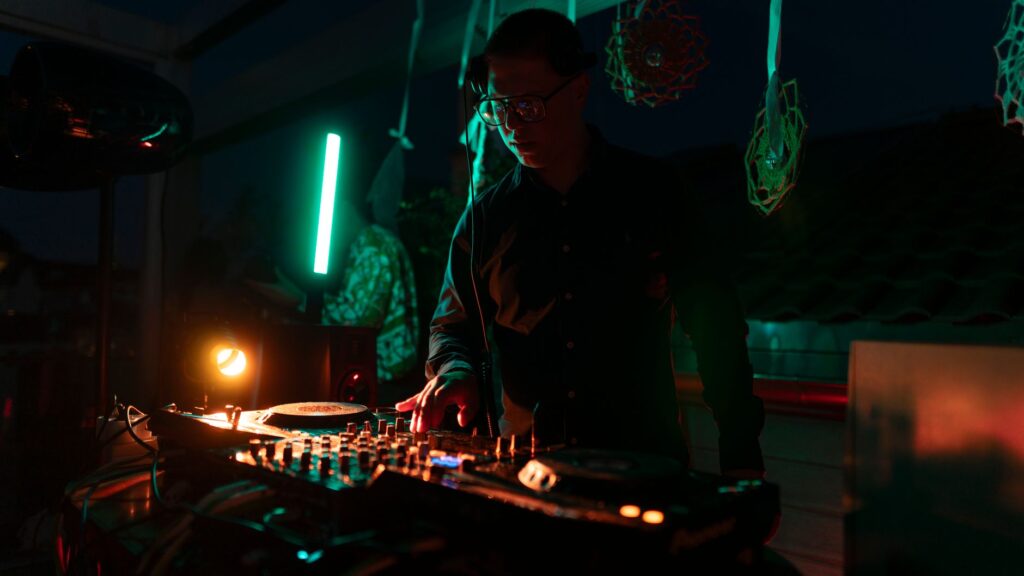 A DJ performing at a popular Las Vegas pool party, with guests dancing and enjoying the music. — Las Vegas pool parties …