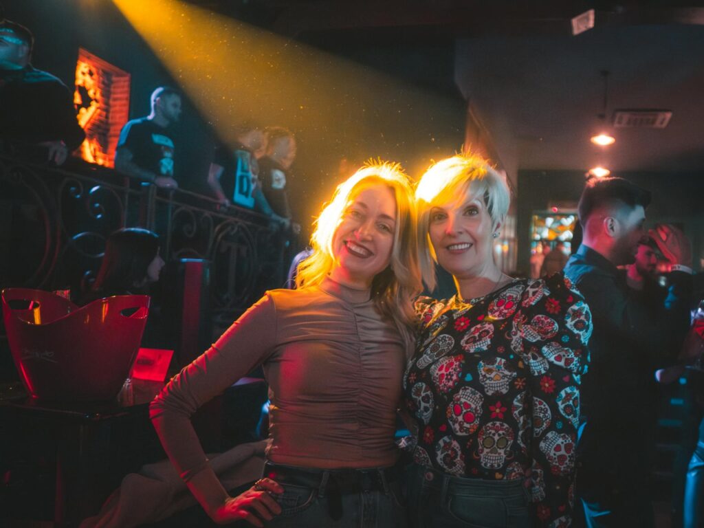 A bustling Las Vegas nightclub with people dancing and colorful lights. — Las Vegas nightlife guide