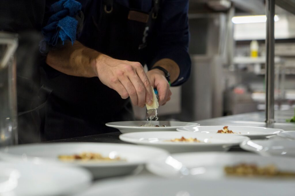 A chef preparing a signature dish in a high-end restaurant. — best restaurants las vegas