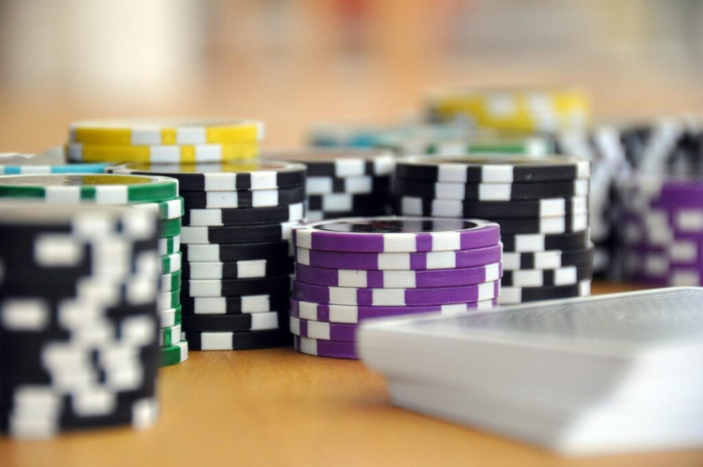 A close-up of casino chips and cards on a table, emphasizing the gaming experience. — Las Vegas casino etiquette