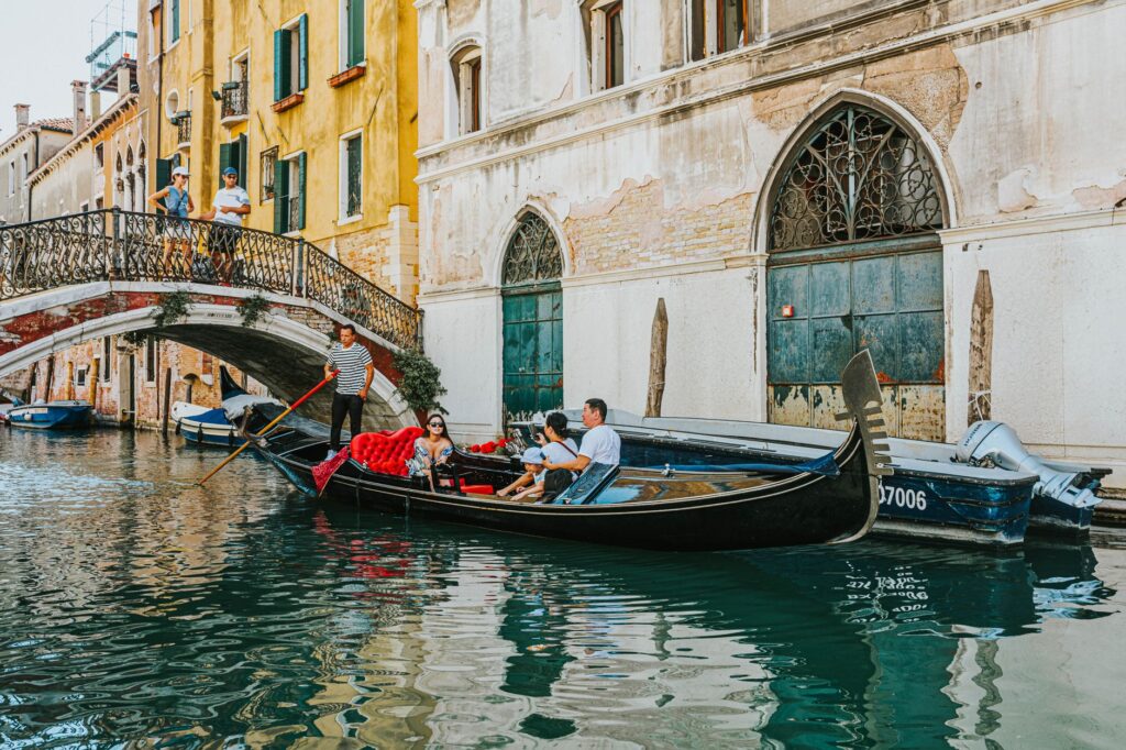 A couple taking a gondola ride at The Venetian, illustrating unique couples activities in Vegas. — romantic las vegas