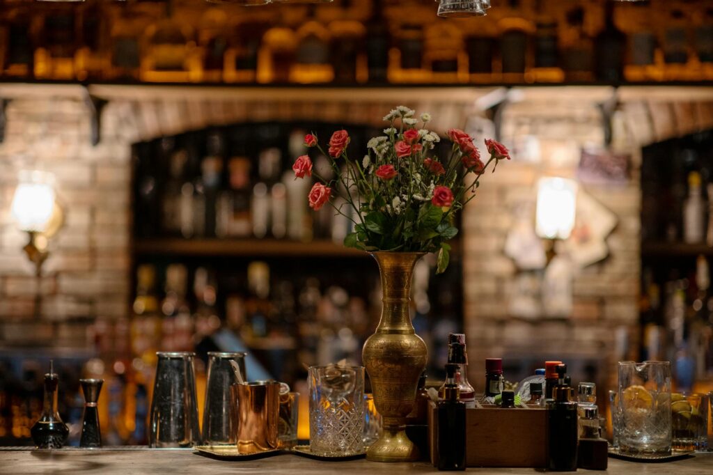 A cozy bar setting showcasing a signature cocktail and a lively atmosphere. — Las Vegas nightlife
