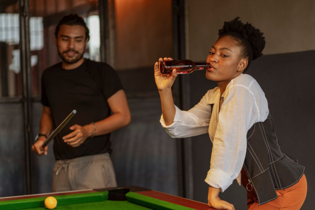 A cozy budget-friendly bar with people enjoying drinks and games. — Las Vegas nightlife on a budget