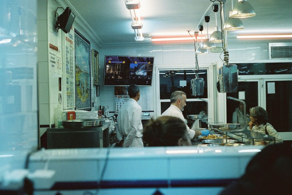 A cozy interior shot of a budget-friendly diner with happy patrons enjoying their meals. — affordable restaurants Las Vegas
