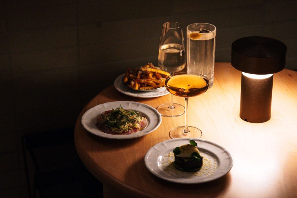 A cozy restaurant ambiance during happy hour, featuring drinks and appetizers. — best restaurants in Las Vegas