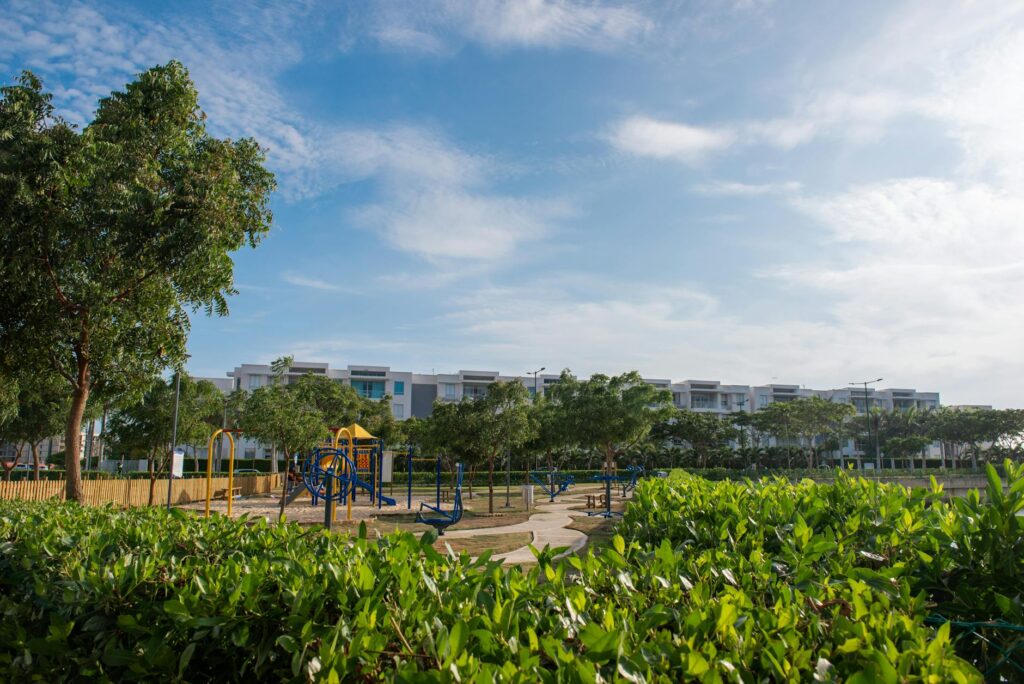A family enjoying a day at a Las Vegas park, surrounded by greenery and playground equipment. — family activities Las Vegas