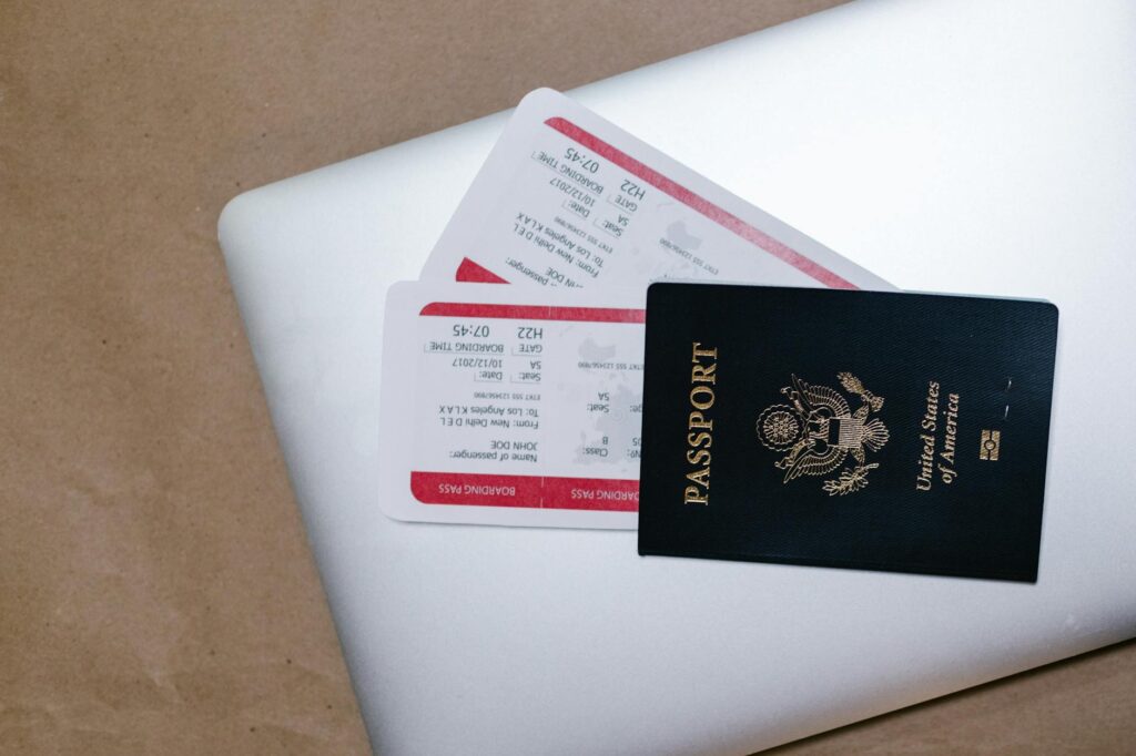 A flat lay of travel documents, including ID, tickets, and hotel confirmations, related to the packing list for Las Vegas.