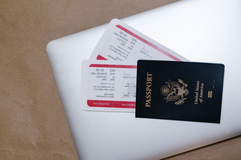 A flat lay of travel documents, including a passport, tickets, and hotel reservation, relevant to your packing list Las Vegas