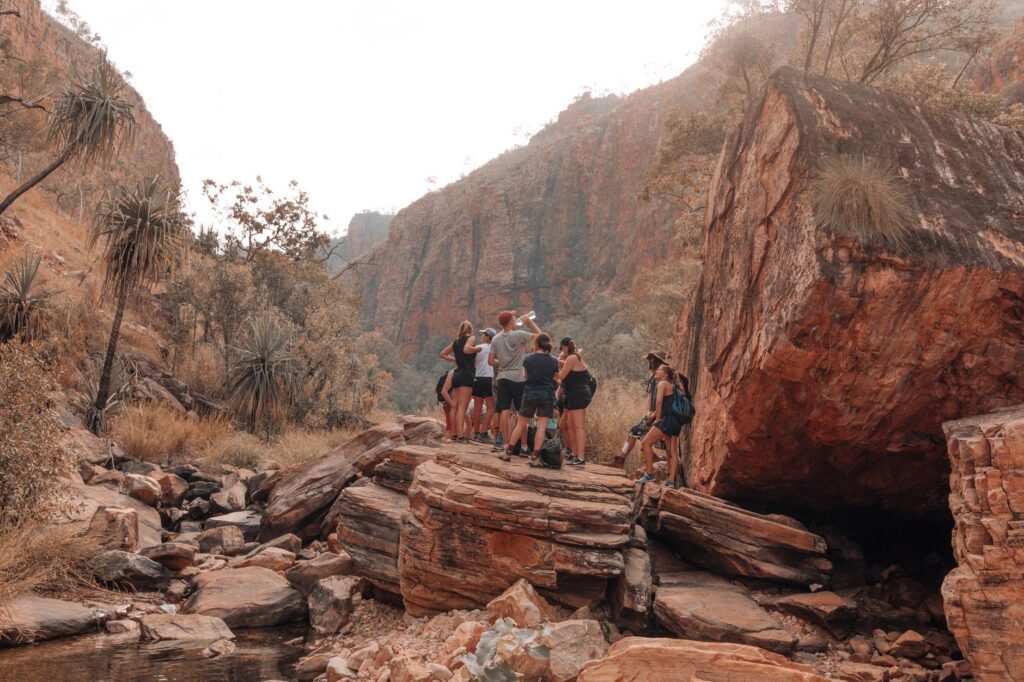 A group of friends hiking in Red Rock Canyon, emphasizing outdoor activities. — save money on Vegas attractions