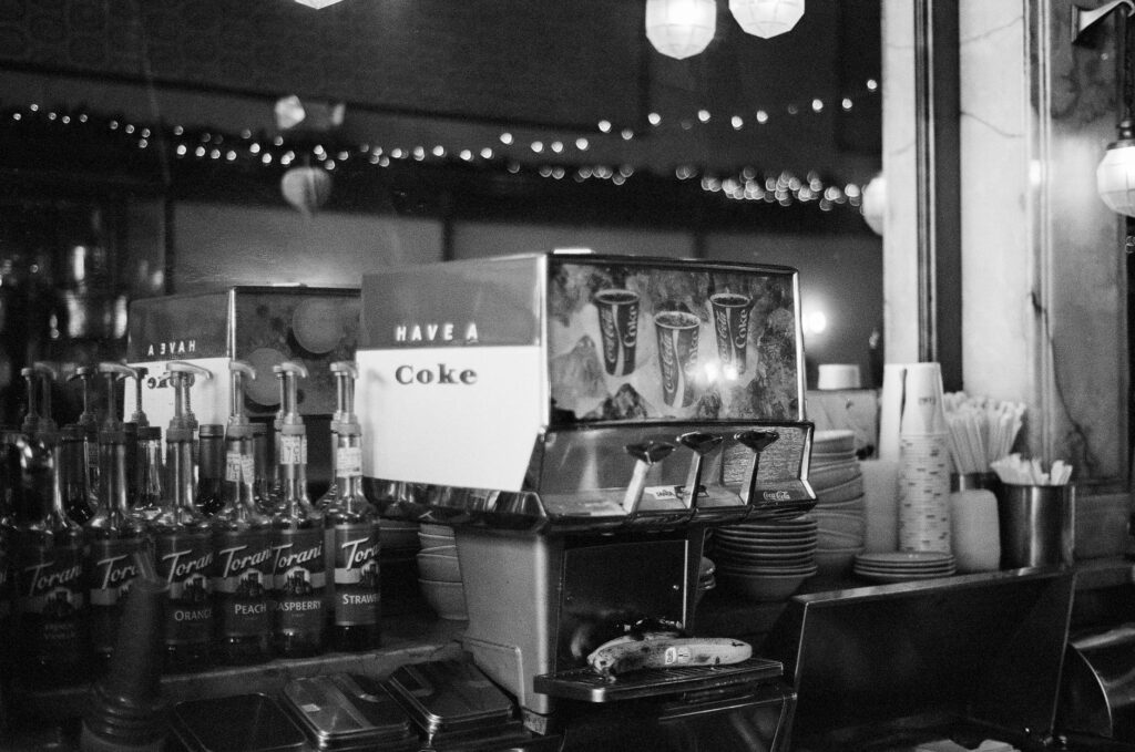 A photo capturing the interior of a popular casino with drink stations. — free drinks in Las Vegas