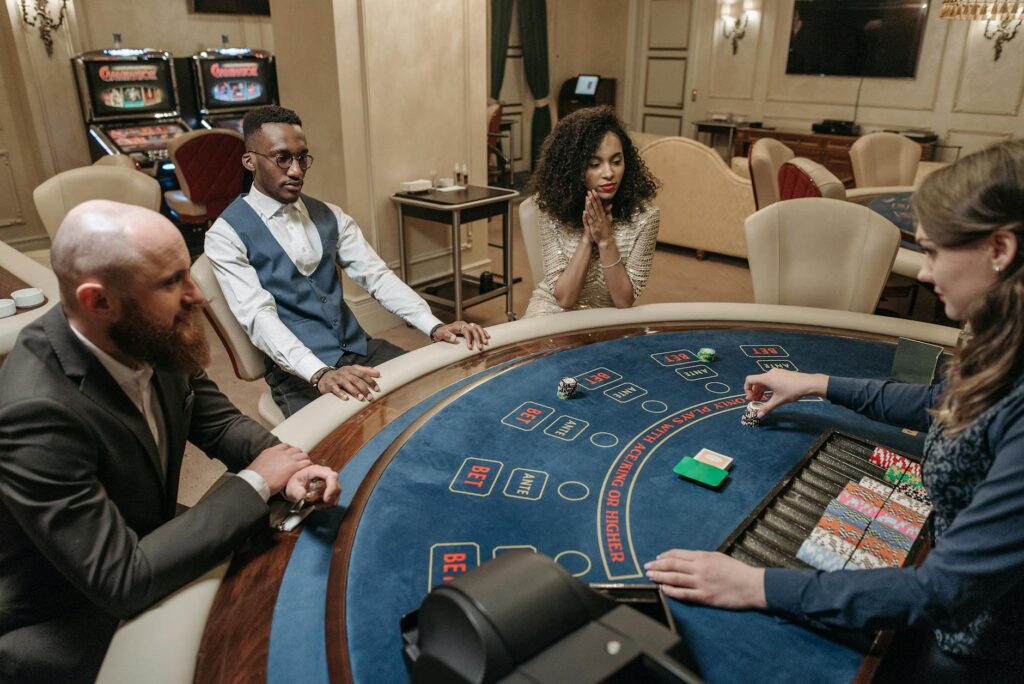 A photo of players gathered around a blackjack table, focusing on proper etiquette. — Las Vegas casino etiquette