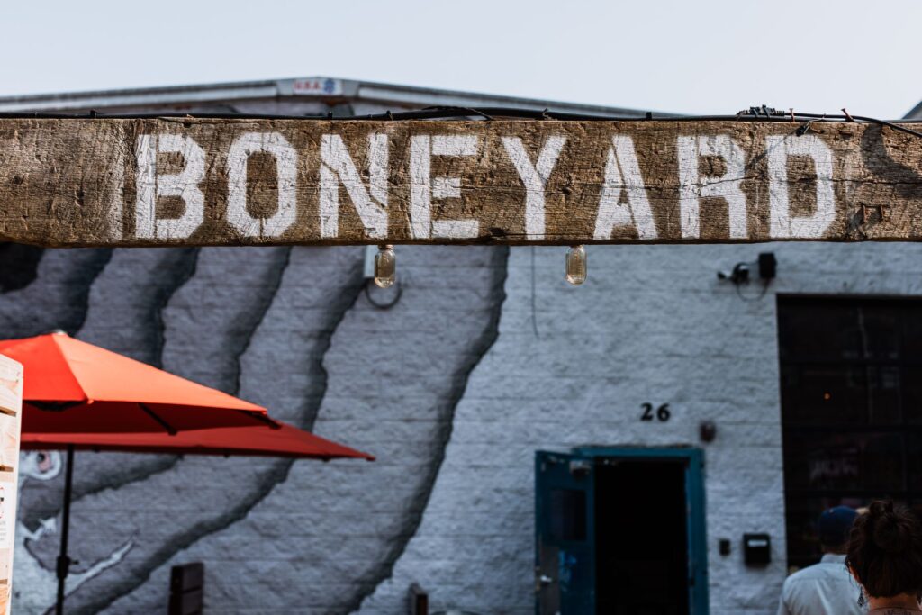 A stunning sunset view over the Neon Boneyard showcasing vintage signs — unique experiences Las Vegas