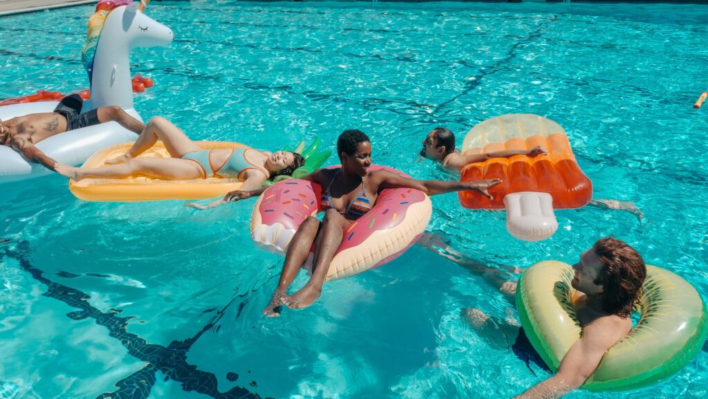 A sunny pool scene with people enjoying the warm weather in Las Vegas. — best time to visit las vegas