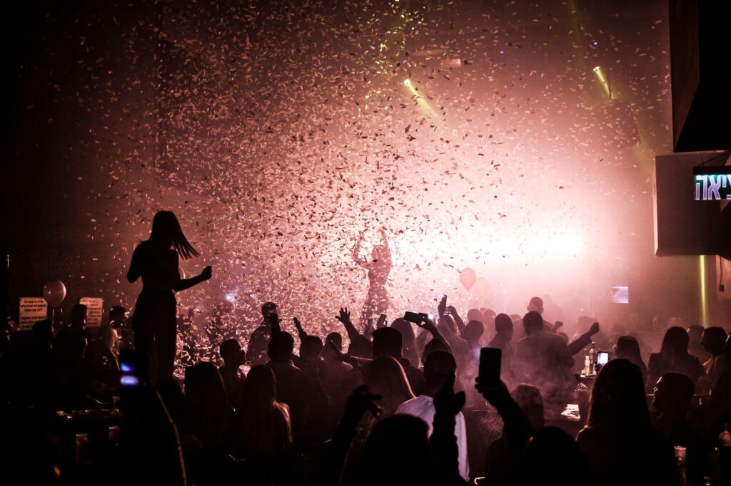 A vibrant nightclub scene showcasing dancers and DJ performances. — Las Vegas nightlife guide