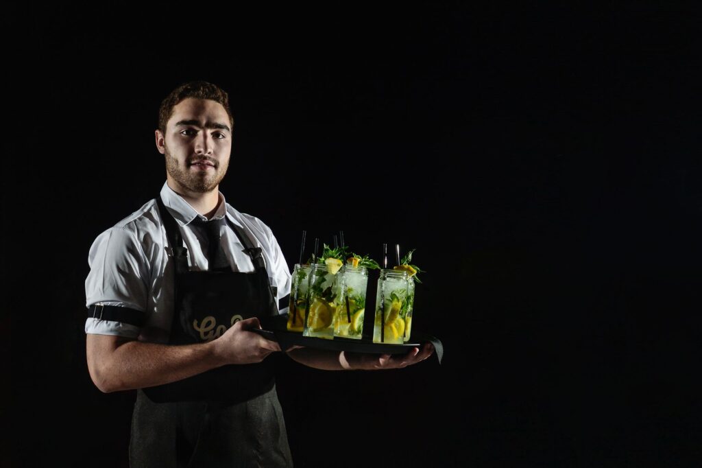 A vibrant photo of a bartender serving drinks in a Las Vegas casino. — free drinks in Las Vegas