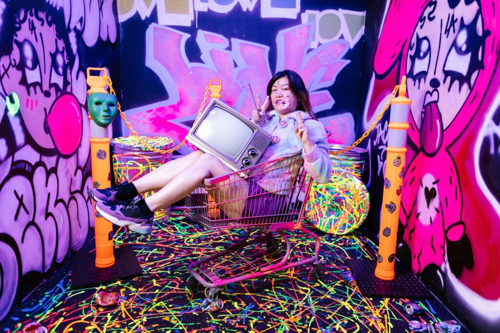 A vibrant scene from The Neon Museum with guests enjoying immersive dining — unique restaurants Las Vegas