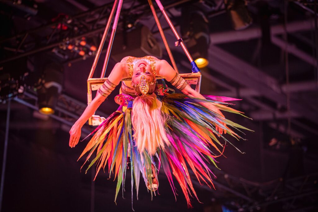 A vibrant scene from a unique Las Vegas show featuring acrobatics and lights. — unique Vegas entertainment