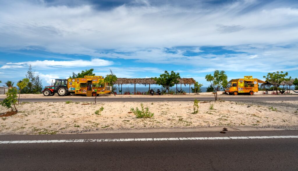 A vibrant street scene showcasing multiple food trucks parked together. — best food trucks in Las Vegas