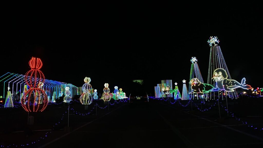 An aerial shot of winter festivities on the Strip with holiday lights. — best time to visit Las Vegas