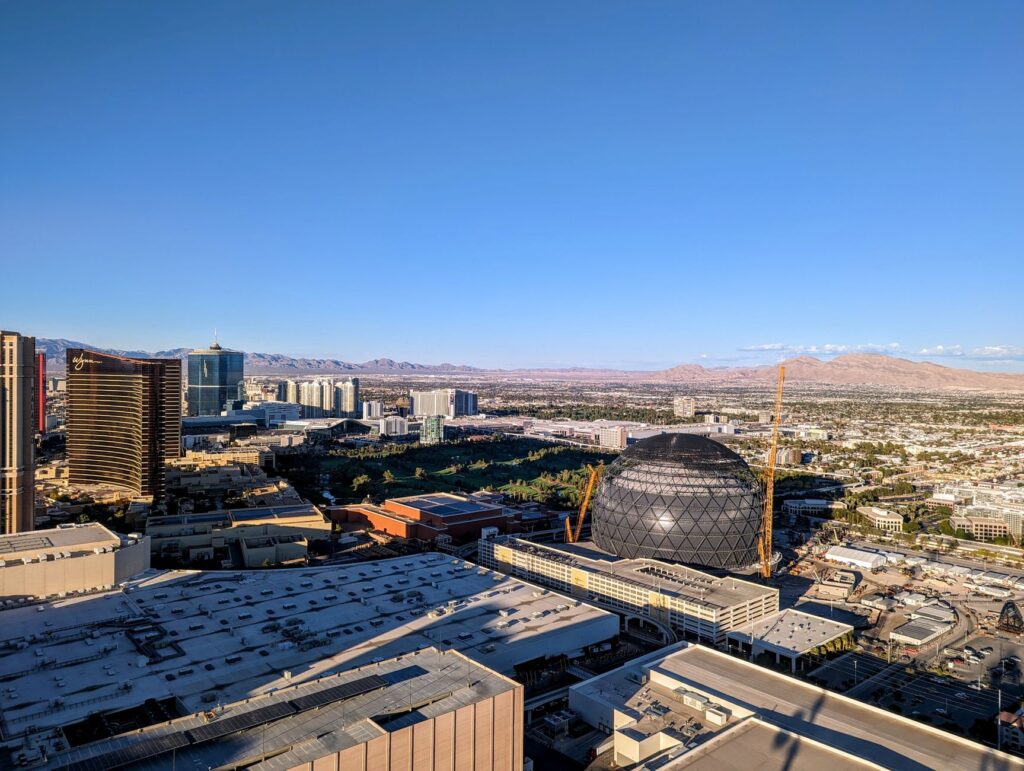 An aerial view of Las Vegas Strip contrasting with the serene Red Rock Canyon. — hidden gems las vegas