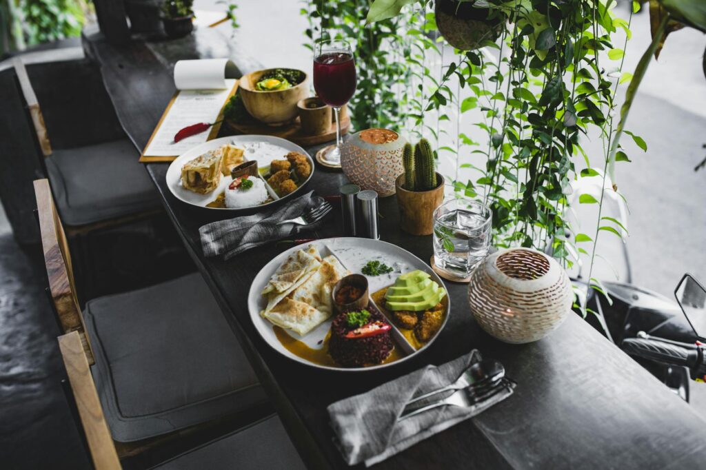 An eclectic local restaurant serving unique dishes, with patrons enjoying their meals in a charming setting. — hidden ge…