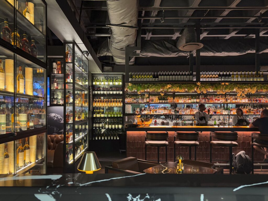 An upscale cocktail bar with elegant decor and patrons enjoying drinks. — Las Vegas nightlife guide