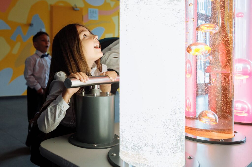 Children exploring interactive exhibits at a Las Vegas museum, showcasing their excitement. — family activities Las Vegas