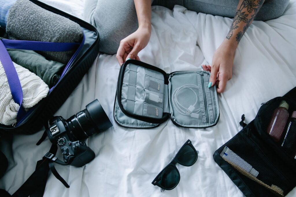 Essential travel gadgets and gear laid out for a Vegas vacation. — las vegas packing list