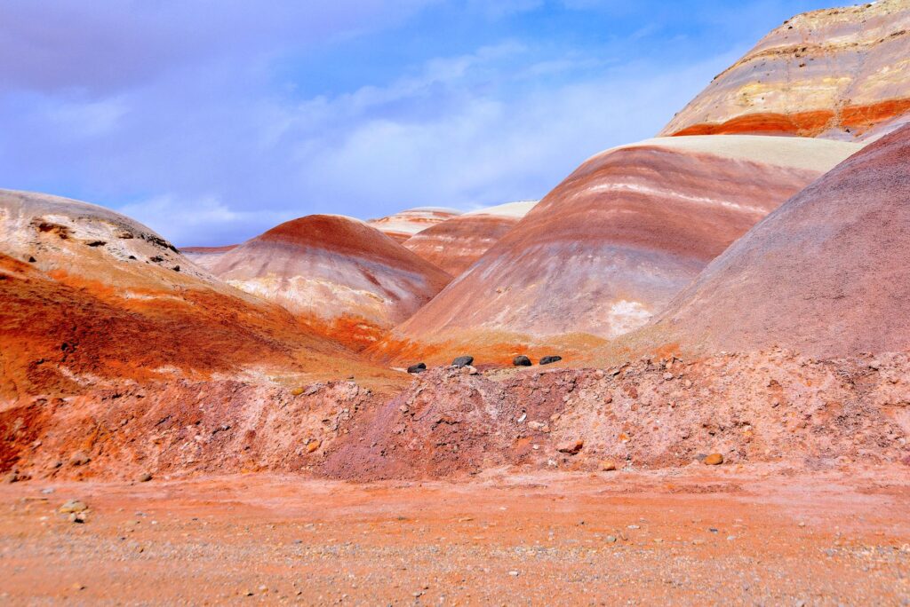 Panoramic shot of Calico Hills showcasing the vibrant colors of the rocks. — red rock canyon vegas