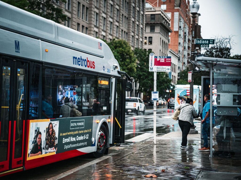 Photo of a Deuce bus at a busy stop on the Strip — las vegas transportation