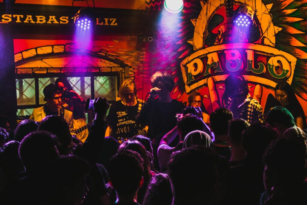 The vibrant Fremont Street Experience filled with colorful lights and crowds enjoying live music. — Las Vegas attraction…