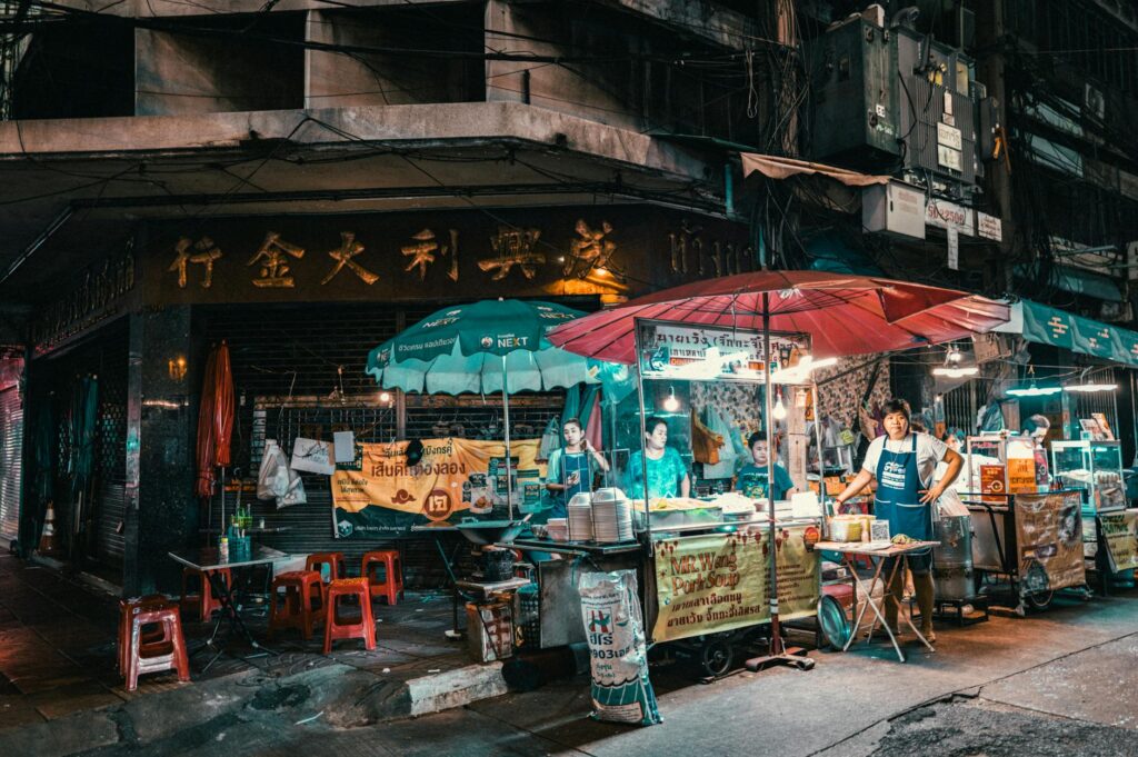Tour participants enjoying street food at a local market — food tours in Las Vegas