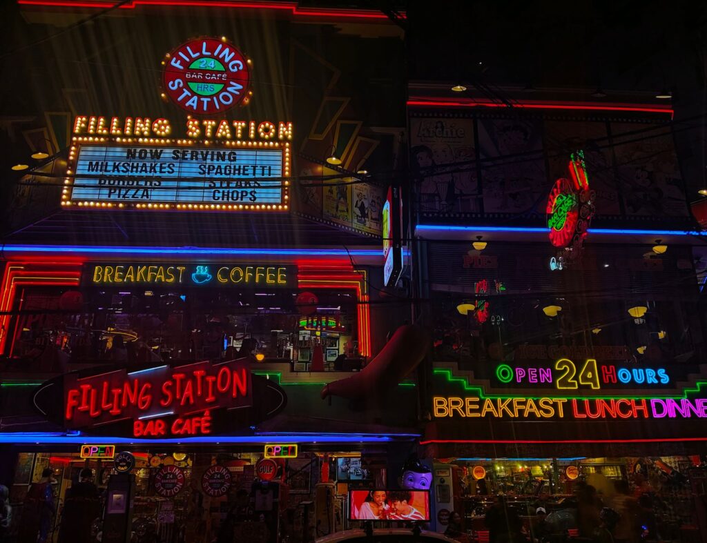 Visitors exploring the Neon Museum filled with vintage signs — 3 days in las vegas
