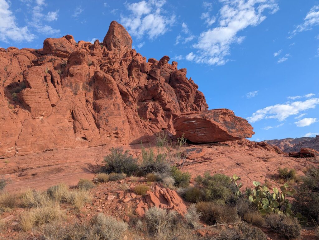 Visitors hiking through the unique sandstone formations in the Valley of Fire. — las vegas day trips