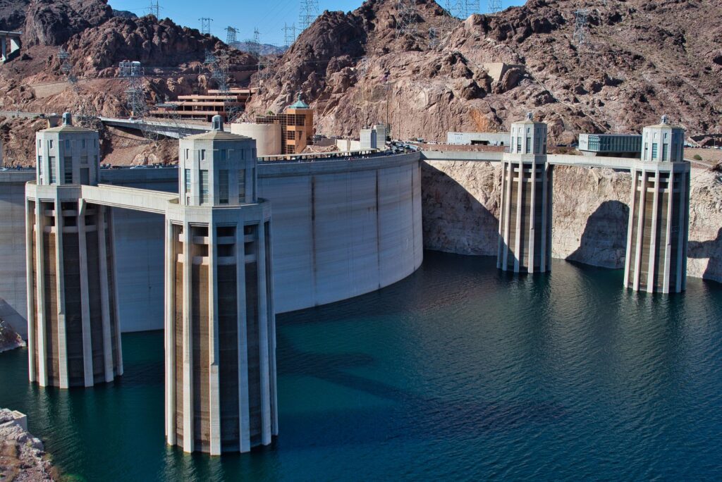 Visitors taking photographs at the Hoover Dam overlook, capturing the stunning landscape. — hoover dam tour las vegas