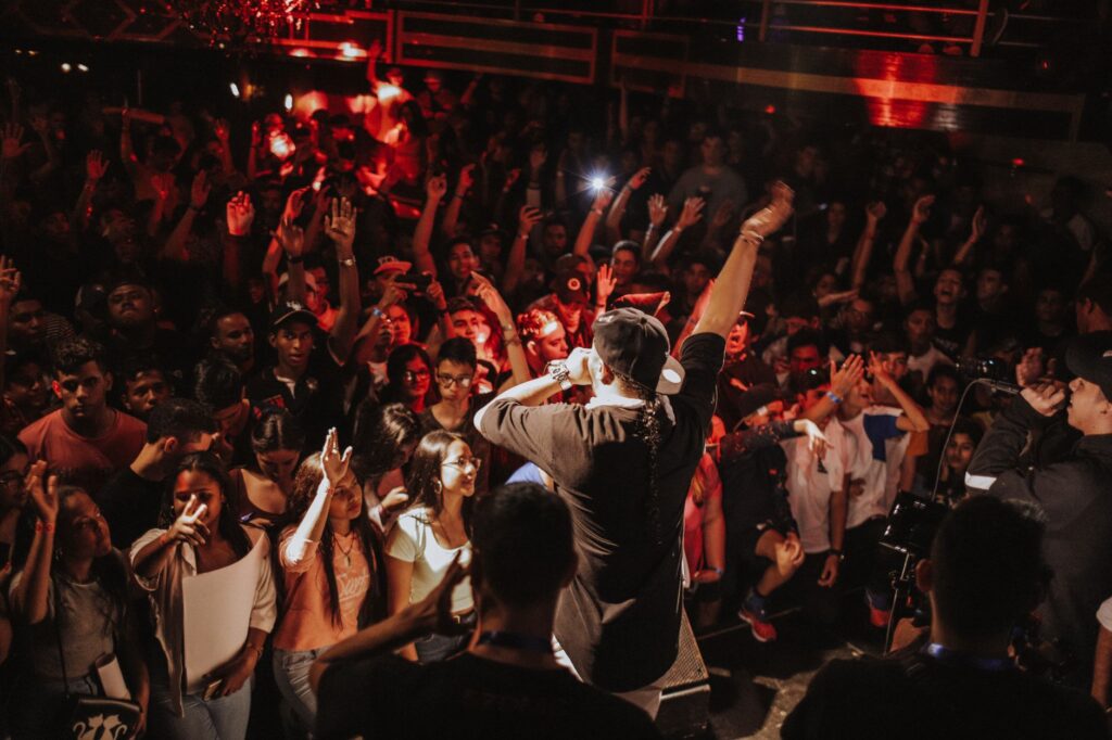 A DJ performing live at XS nightclub, with an enthusiastic crowd dancing. — Las Vegas nightclubs