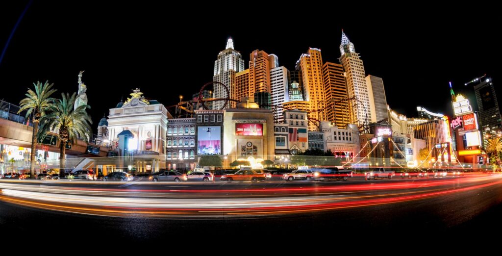 A bustling Las Vegas Strip showing taxis and tourists. — las vegas transport