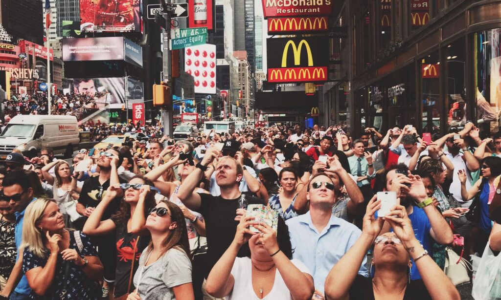 A bustling scene of tourists exploring the Strip, capturing the excitement of first-time visitors. — Las Vegas Strip guide