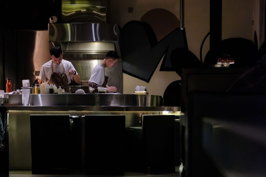 A chef at work in a new Las Vegas restaurant, illustrating culinary creativity. — new restaurants Las Vegas 2026