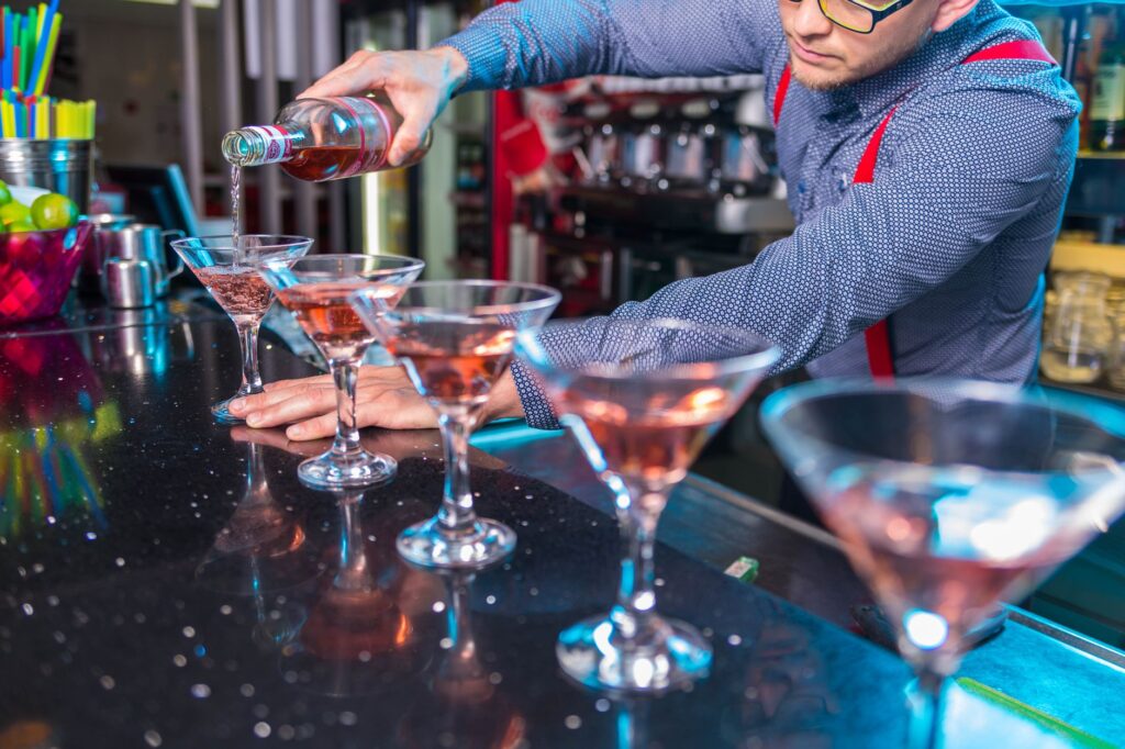 A colorful cocktail being served at a Las Vegas nightclub bar, representing the diverse drink offerings. — Las Vegas nig…