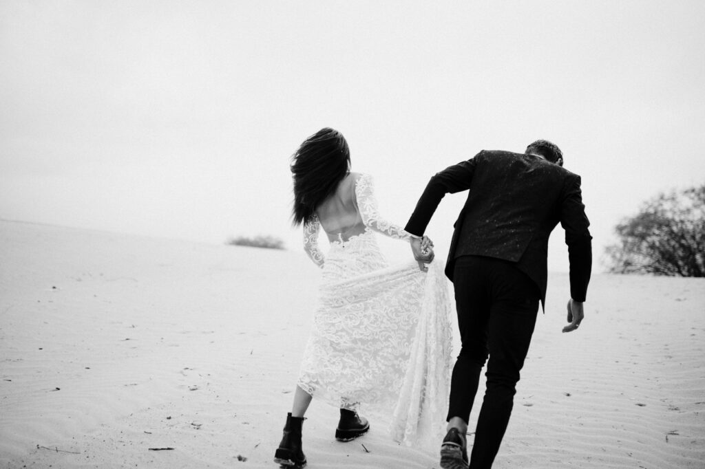 A couple celebrating their elopement in a picturesque desert backdrop near Las Vegas. — planning a Vegas wedding