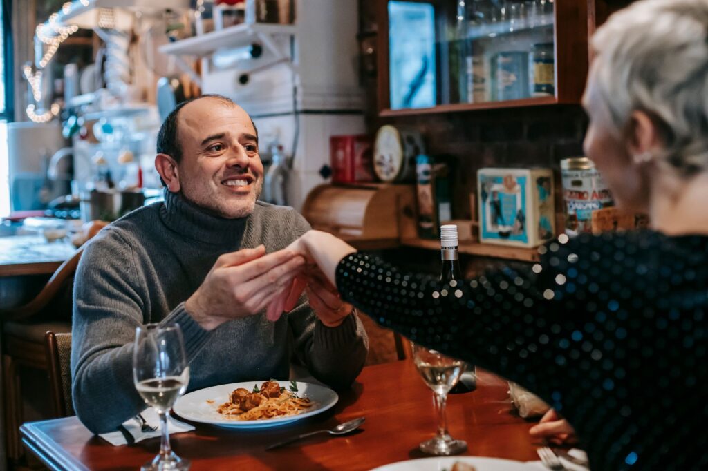 A couple enjoying a meal at a budget-friendly restaurant near a cheap hotel in Vegas. — budget hotels in Las Vegas