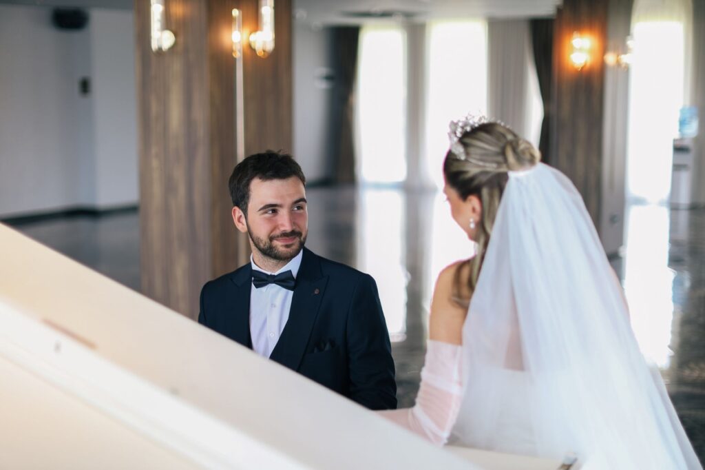 A couple touring a potential wedding venue, discussing their plans with a wedding planner. — Vegas wedding venues