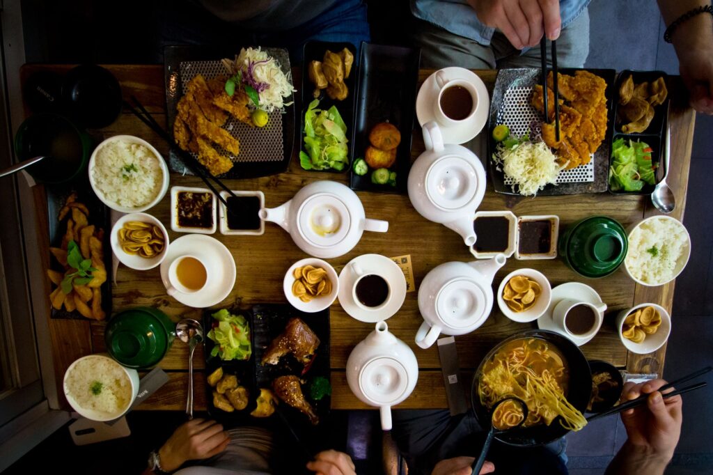 A dining scene from a popular restaurant on the Strip, featuring delicious dishes and happy diners. — first trip las vegas