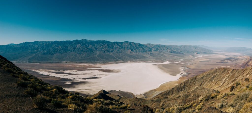 A dramatic landscape of Death Valley National Park, showcasing its vast desert vistas. — scenic drives las vegas