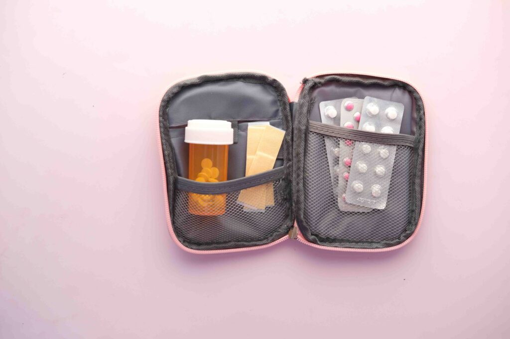 A first aid kit displayed with essential items for travelers, emphasizing the packing list for Las Vegas summer.