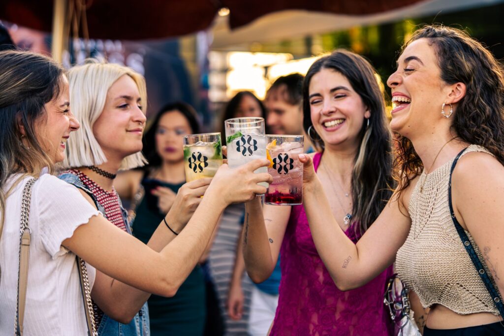 A group of friends laughing and celebrating at a popular Las Vegas festival. — las vegas entertainment