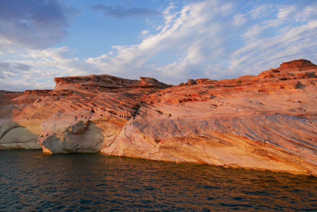 A panoramic image of Red Rock Canyon at sunset, showcasing the dramatic rock formations and colorful sky. — las vegas su…