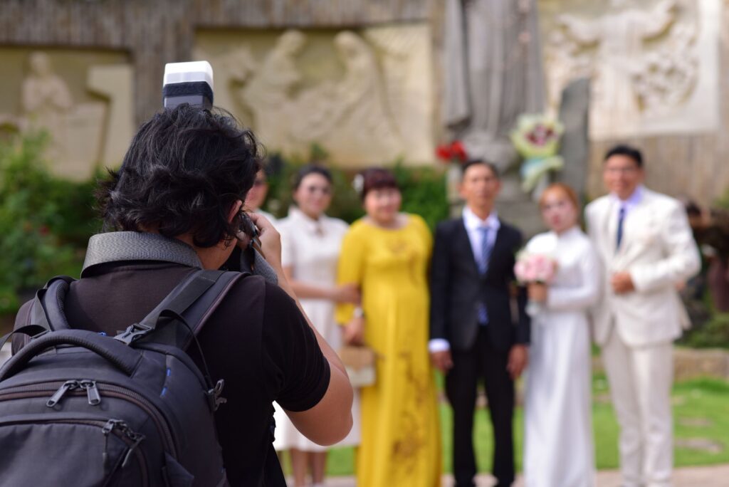 A photographer capturing a couple's special wedding moment in the city. — las vegas wedding guide